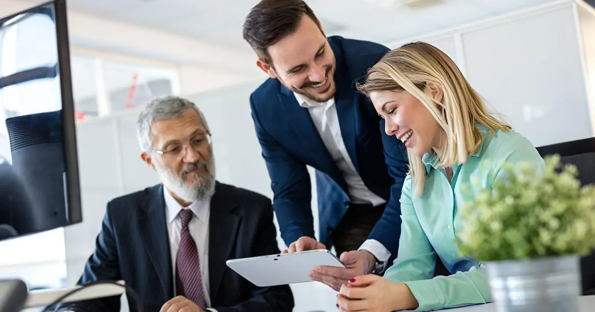 three professionals going over options and partnering on solutions