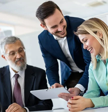 three professionals going over options and partnering on solutions