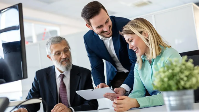 three professionals going over options and partnering on solutions
