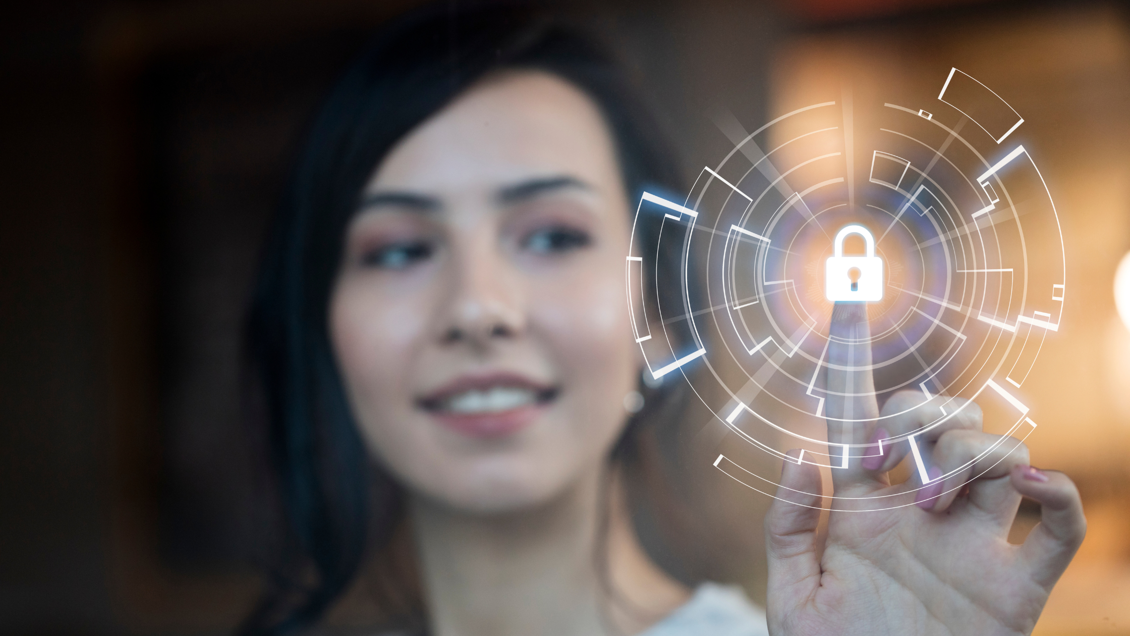 Female clicking on screen with her finger. Screen displays a padlock.